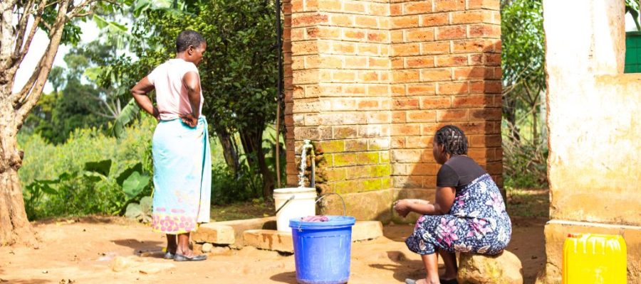 Access to Clean Water – Women from TA Nchiramwela drawing water from a tap installed by CCDO.