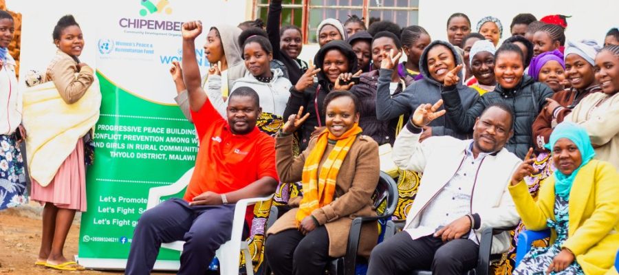 CCDO Executive Director (left), District Peace and Unity Committee Chairperson (right), and some of the trained girls. UNDER Progressive Peace Building